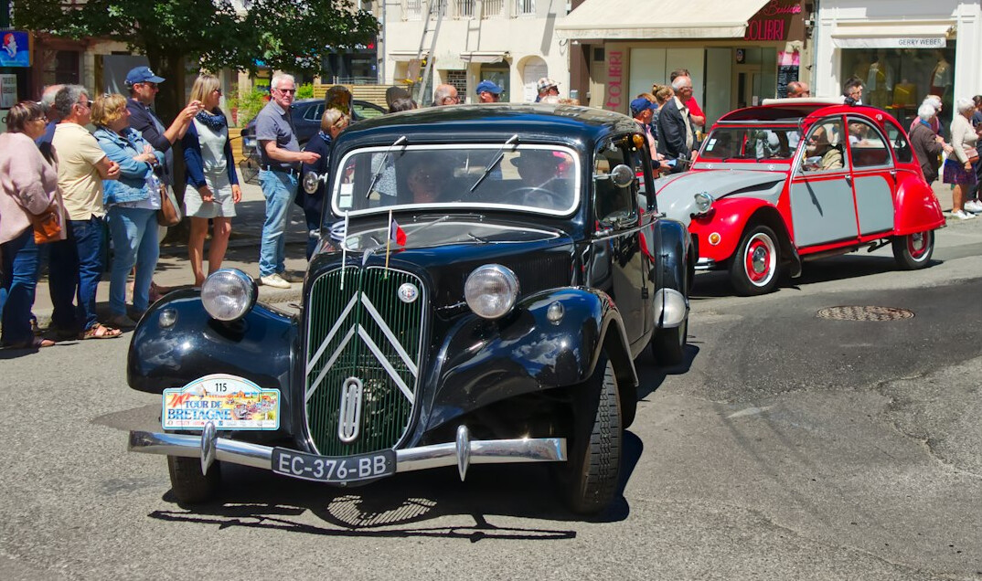 Rows of classic automobiles displayed at an exhibition hall