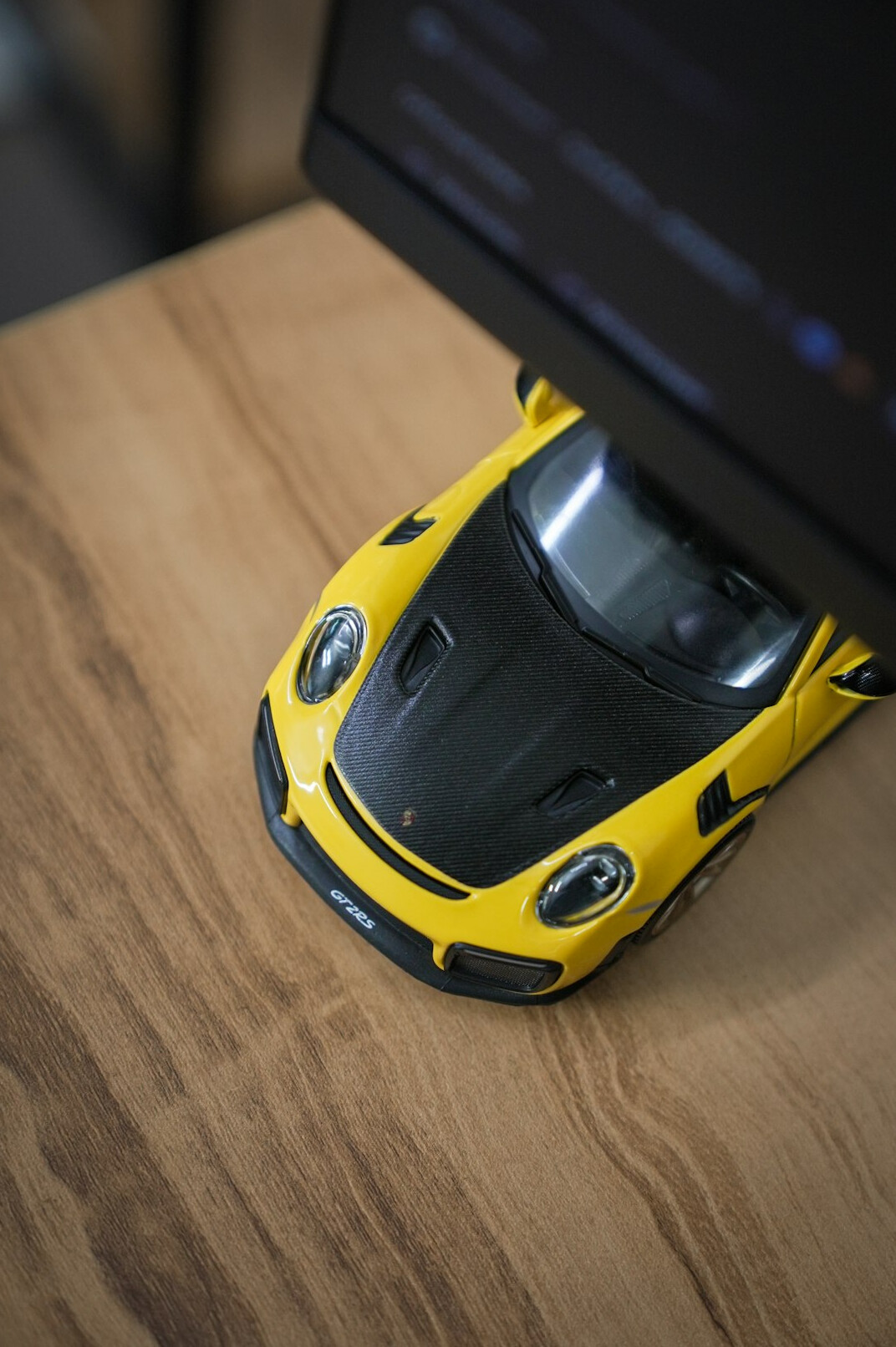 Editorial desk covered with vintage automobile photographs and archive documents